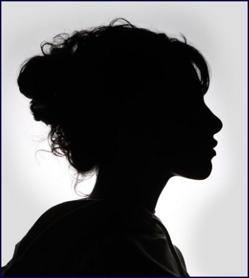 Female counselling client in silhouette