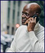 Man on a phone, like a counselling client contacting me from afar...